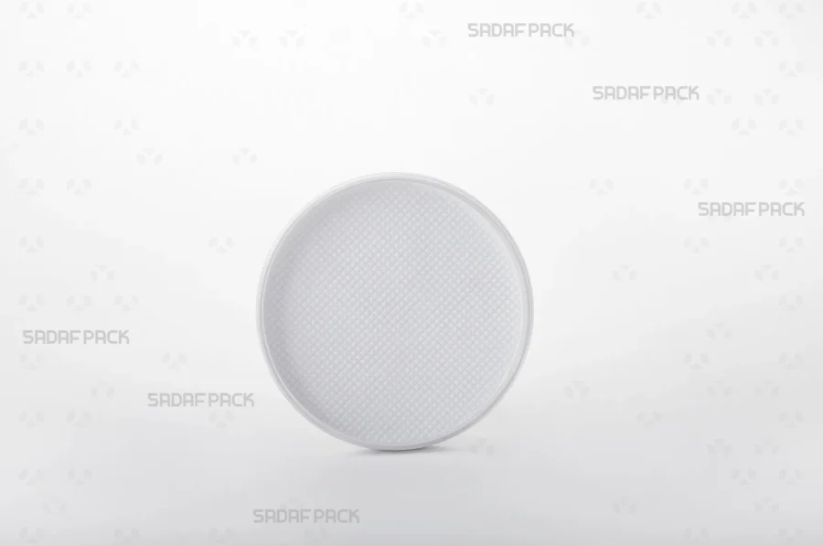 Front view of the 9 España container, highlighting its clear poly-crystal lid and distinctive white base structure.