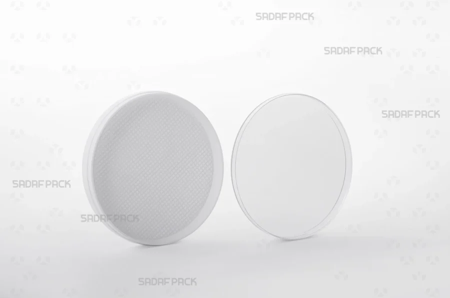 The 9 España container shown with its lid and body separated side-by-side, displaying the interior space designed to hold saffron.