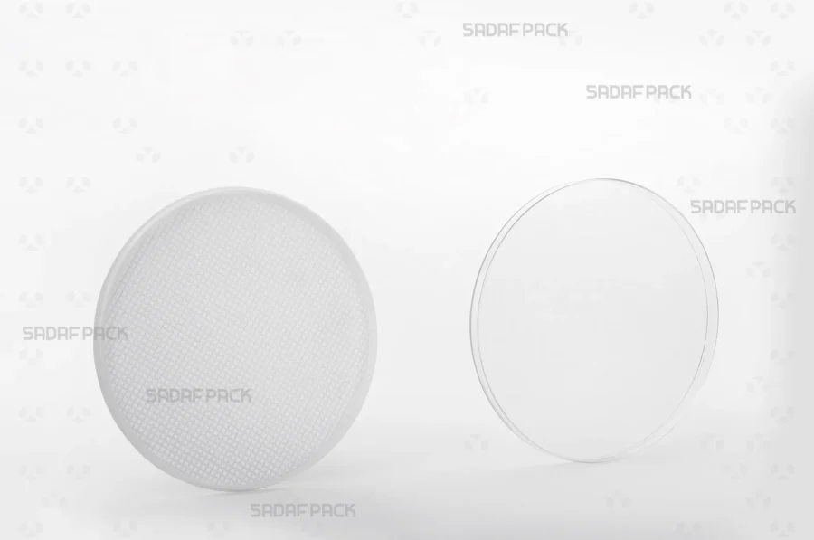The 9.5 España container shown with its lid and body separated side-by-side, displaying the interior space designed for saffron.