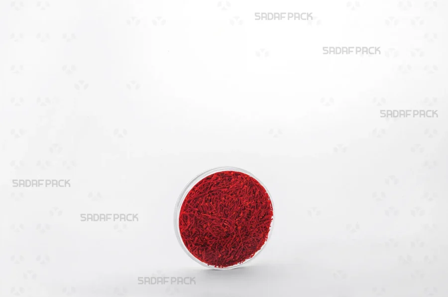 The 6.5 Flat Crystal container expertly filled with saffron, demonstrating its capacity and suitability for high-end export products.