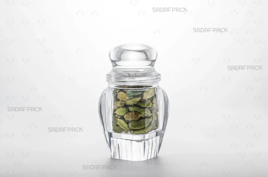 A three-quarter angle view of the Gohar 4 container filled with cardamom, demonstrating its suitability for export-quality packaging.