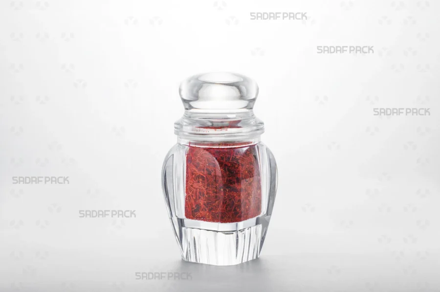 A three-quarter angle view of the Gohar 4 container filled with saffron, demonstrating its suitability for export-quality packaging.