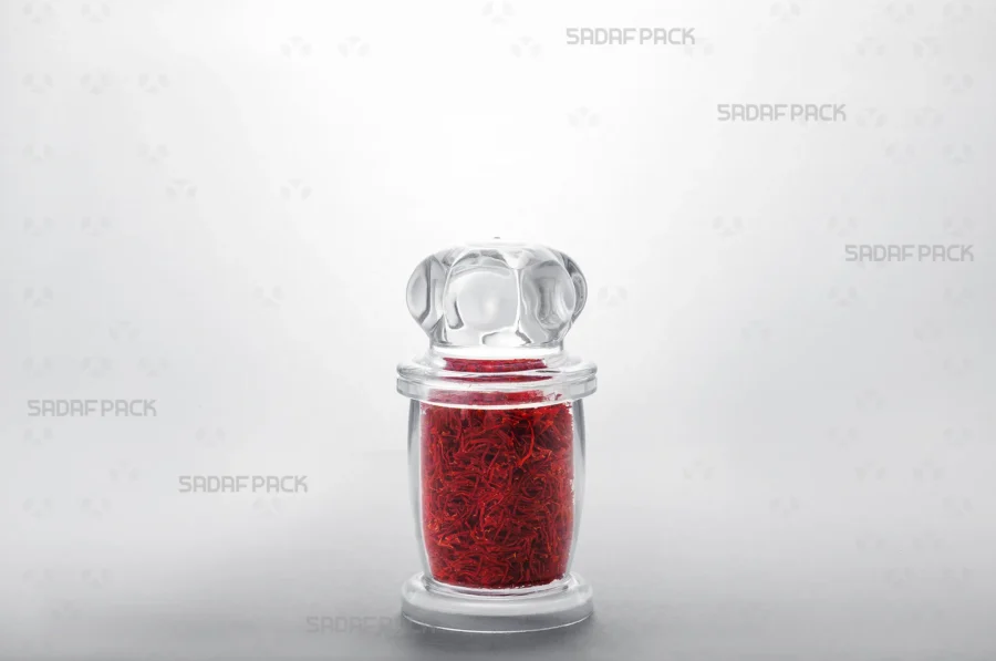 A three-quarter view of the Milad 3 container filled with saffron, demonstrating its suitability for export-quality food products. 