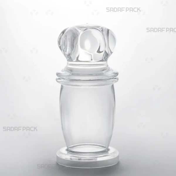 Three-quarter angle view of the Milad 4 crystal container by Sadaf Pack, showcasing its clear, high-quality polycrystal structure.
