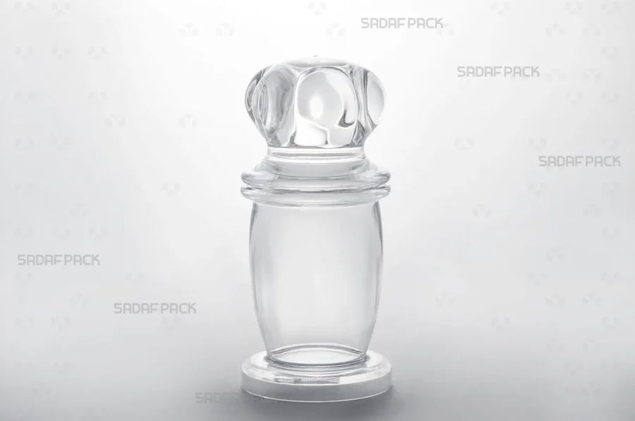 Three-quarter angle view of the Milad 4 crystal container by Sadaf Pack, showcasing its clear, high-quality polycrystal structure.