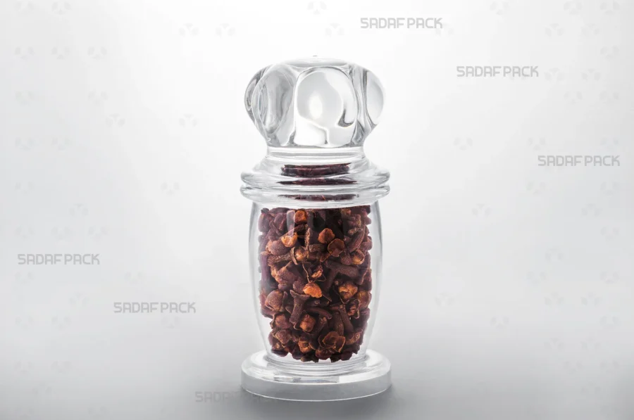 A Milad 4 crystal container filled with cloves, demonstrating its suitability for exporting high-value food products.