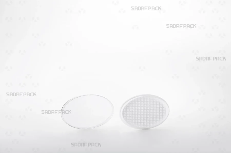 The Oval 2 España container displayed with its lid and body separated side-by-side, showcasing the pristine interior space designed to protect saffron's quality.