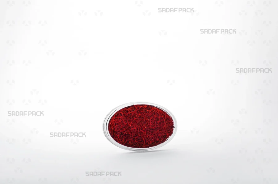 An Oval 4 Crystal container filled with high-quality saffron, demonstrating its use for luxury export-grade saffron. 