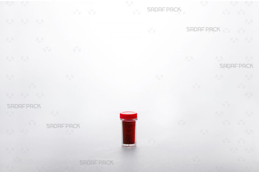 Powder Tall Red Container filled with saffron powder, showcasing its capacity and the clear visibility of the export-quality contents.