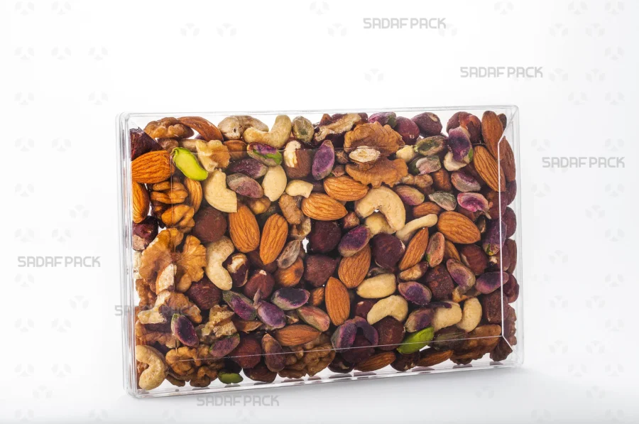 The Rectangle 200 container filled with nuts, showcasing its excellent clarity for premium product presentation suitable for export.