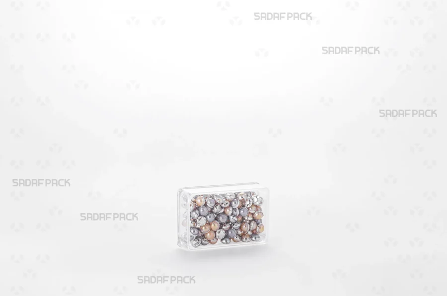 An elegant display of the 4 Deep Crystal Rectangle container filled with luxury beads, making it a perfect choice for export products.
