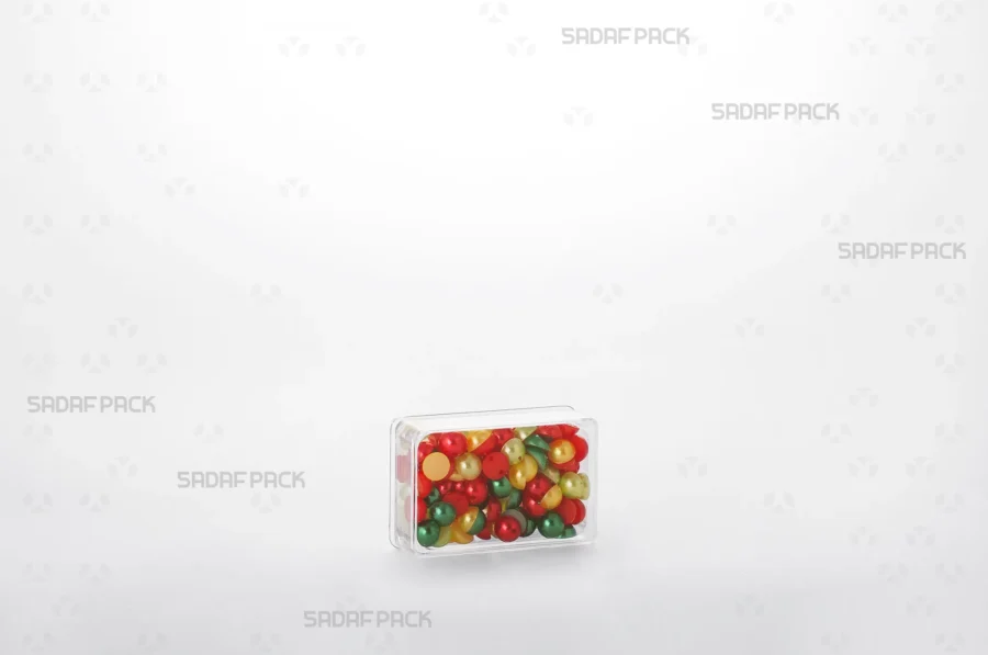 An elegant display of the 4 Deep Crystal Rectangle container filled with red beads, making it a perfect choice for export products.