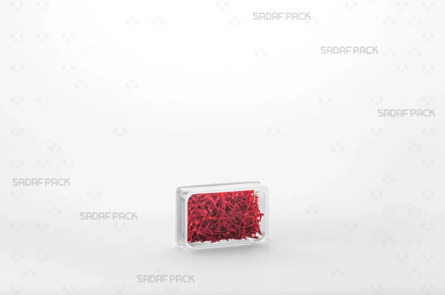 An elegant display of the 4 Deep Crystal Rectangle container filled with saffron, making it a perfect choice for export products.
