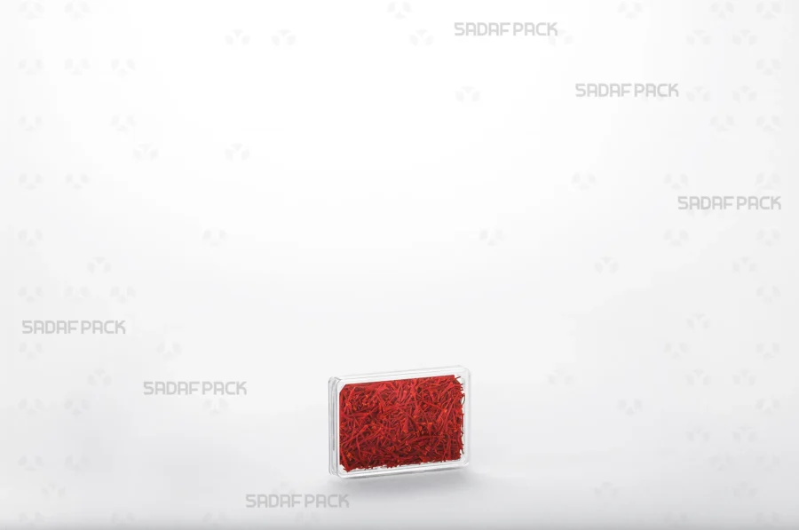 A 4 Slim Crystal Rectangle container filled with saffron, demonstrating its use for premium export-quality packaging. 