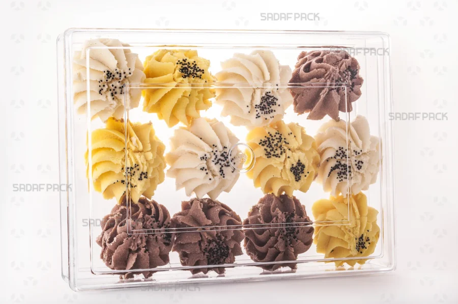 A Rectangle 400 container filled with pastries, demonstrating its excellent clarity for luxury food exports. 