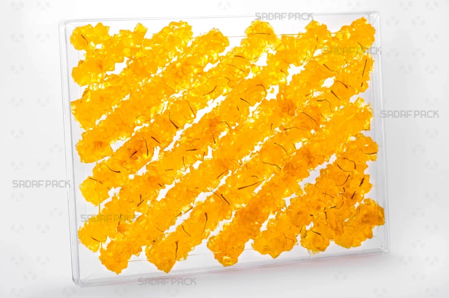 An elegant display of the Rectangle 500 container filled with saffron rock candy, highlighting its suitability for export-quality packaging. 
