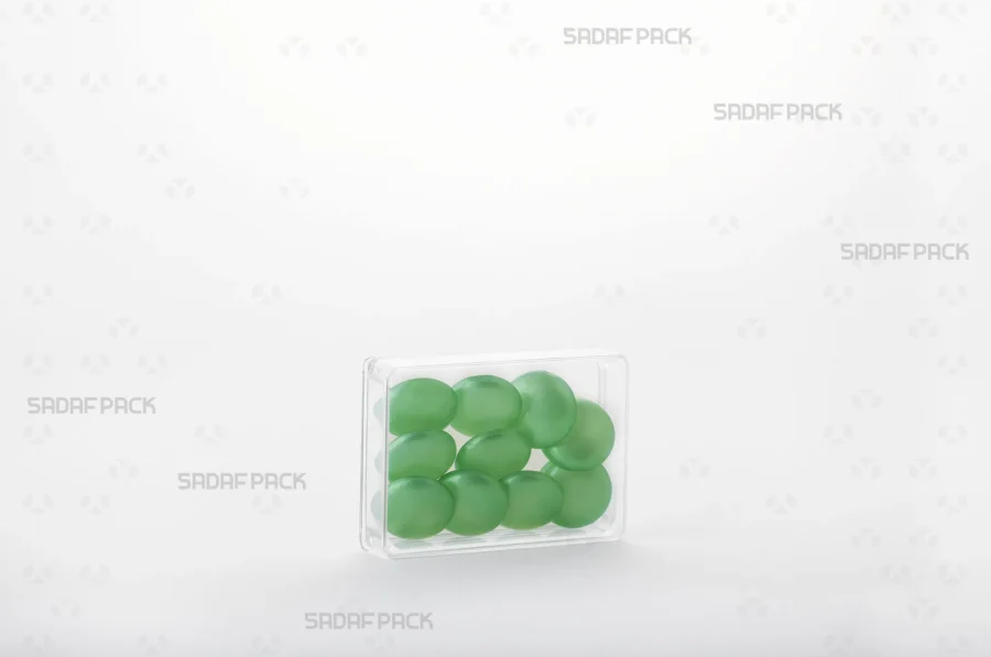 The Rectangle 7 Deep Crystal container filled with high-quality green glass Cabochons, demonstrating its ideal capacity and clarity for export-grade saffron.
