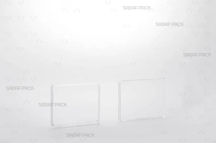 An overhead view of the separated Rectangle 7 Slim Crystal container and its lid, displaying the clean interior and product capacity.