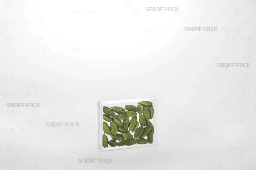 The Sadaf Pack Rectangle 7 Crystal container filled with cardamom, demonstrating its ideal use for high-value export products.