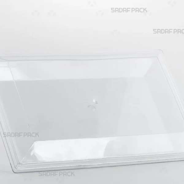 A three-quarter view of the Sadaf Pack Rectangle 300 crystal container, showcasing its large, clear design ideal for packaging premium sweets and nuts.