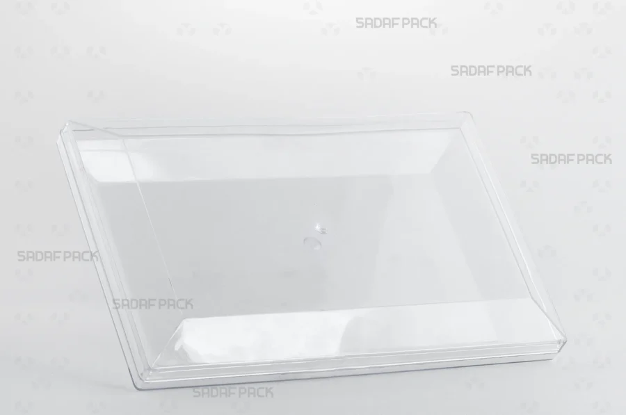 A three-quarter view of the Sadaf Pack Rectangle 300 crystal container, showcasing its large, clear design ideal for packaging premium sweets and nuts.