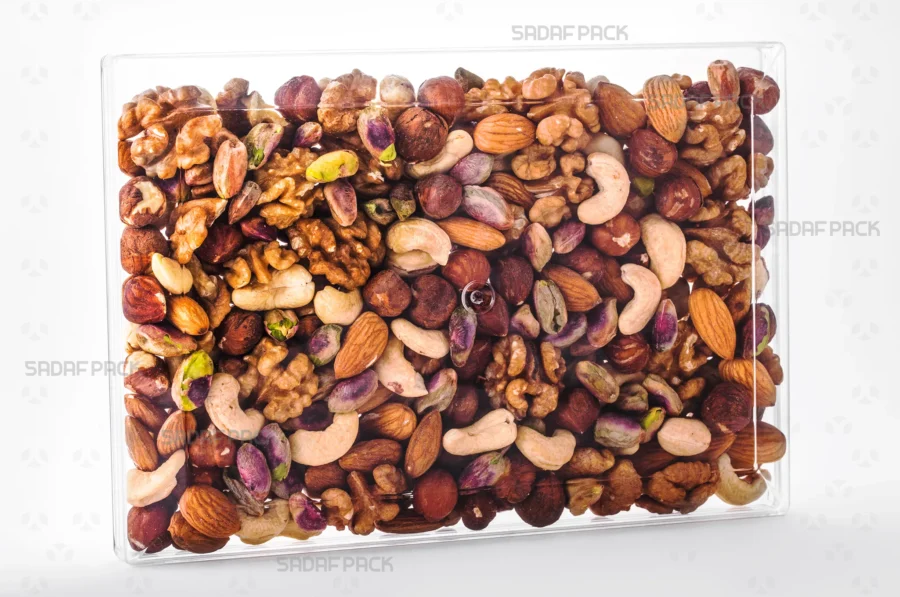 The elegant Rectangle 300 container filled with an assortment of nuts, demonstrating its excellent product visibility and suitability for export gift packaging.