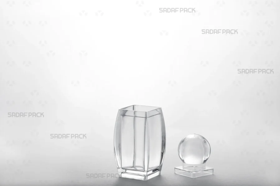 The Sadaf 2 container is displayed with its body and lid separated, revealing the internal space designed for high-value products.