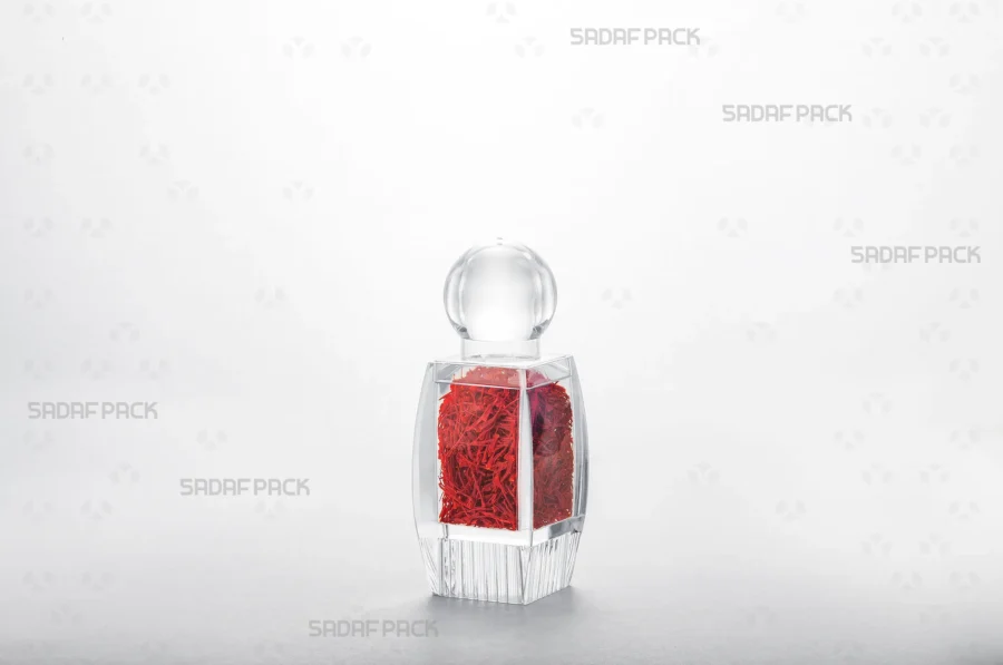 The Sadaf 2 Raised Bottom container filled with saffron, demonstrating its suitability for high-end export packaging and gifting.