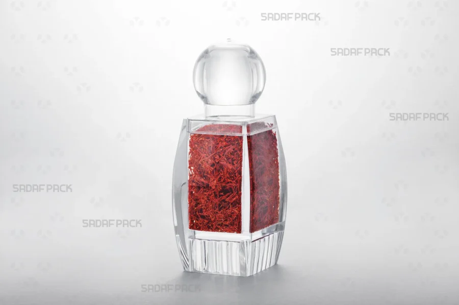 The Sadaf 4 Raised Bottom crystal container filled with saffron, showcasing its suitability for premium export packaging.