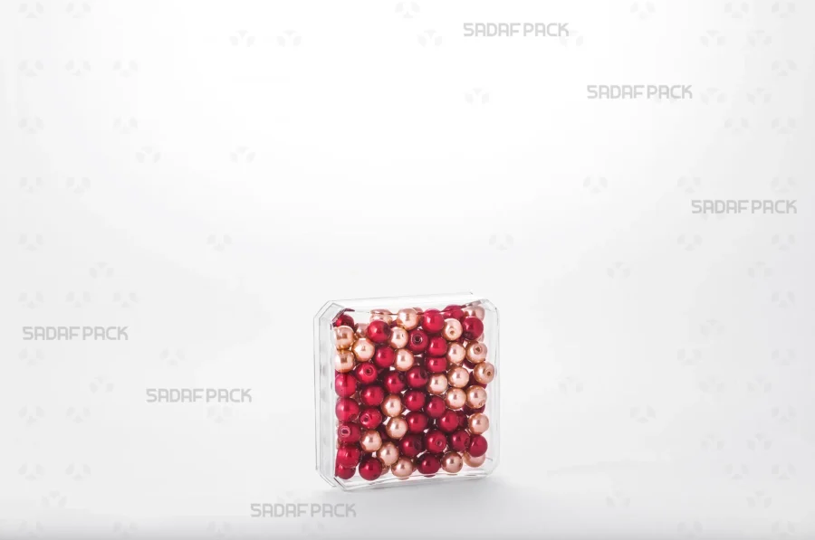 The 4 gram Square container filled with high-quality red beads, demonstrating its capacity and suitability for the export of luxury products.