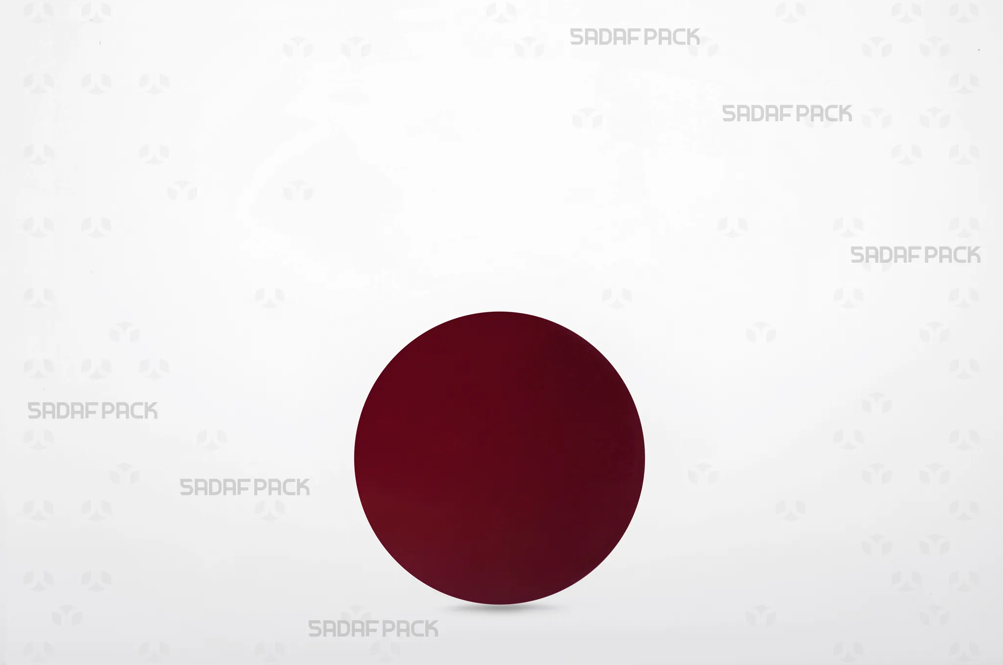 A size 10 circular crimson cardboard pad, designed to be placed inside saffron containers to elevate the contents and enhance the visual presentation.