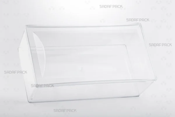 منظر بزاوية ثلاثة أرباع لعبوة مستطيل محدب بلند من صدف باك، يبرز تصميمها الطويل والمنحني.