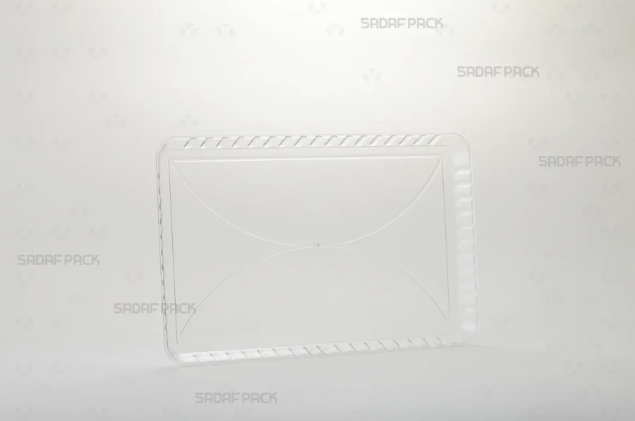 A three-quarter angle view of the Crystal Rectangle Tray 100 by Sadaf Pack, showcasing its elegant design for premium confections.