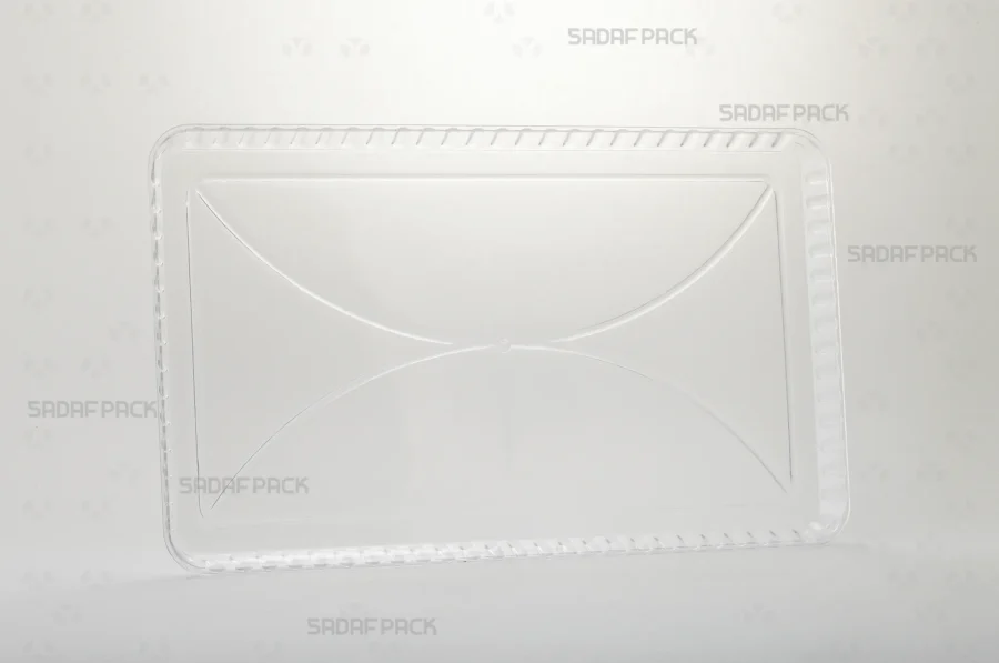 A three-quarter angle view of the Crystal Rectangle Tray 150 by Sadaf Pack, showcasing its clear polycrystal material and rectangular shape. This tray is designed for elegant presentation of sweets, rock candy, and gifts.