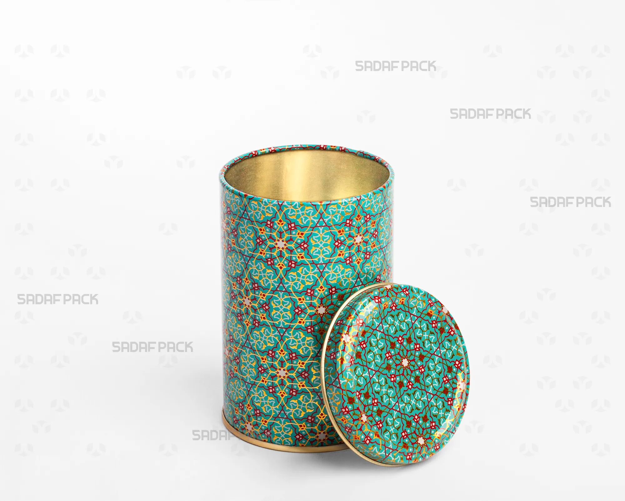 A three-quarter angle view of the Sadaf Pack 7cm diameter by 10cm height metal tin featuring the Turquoise (Firoozeh) pattern, shown with its solid (windowless) lid open and placed beside the base.
