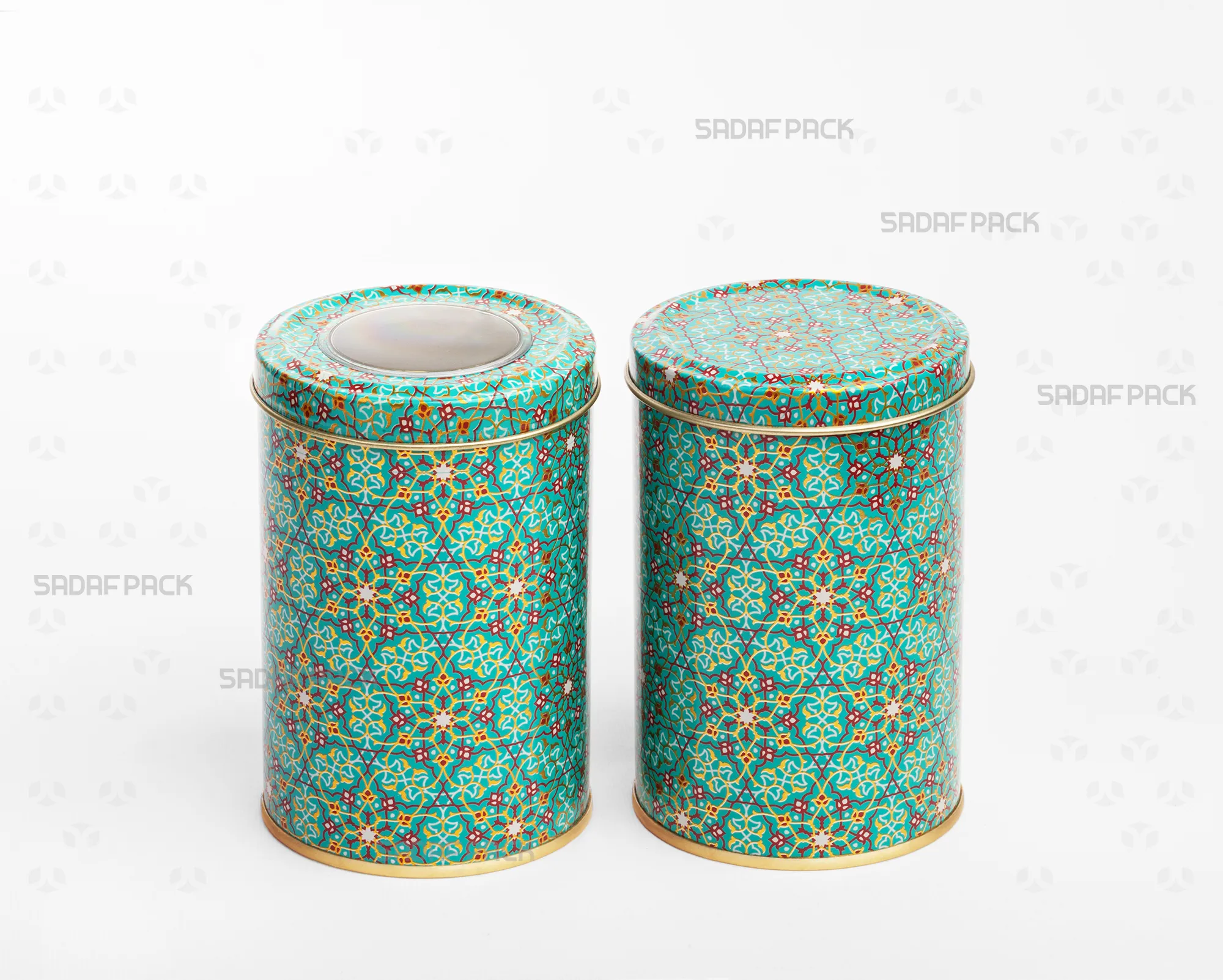 A side-by-side comparison in a three-quarter view of two Sadaf Pack 7cm by 10cm metal tins with the Turquoise (Firoozeh) pattern, both closed, showing the version with a polycrystal window lid and the version with a solid lid.