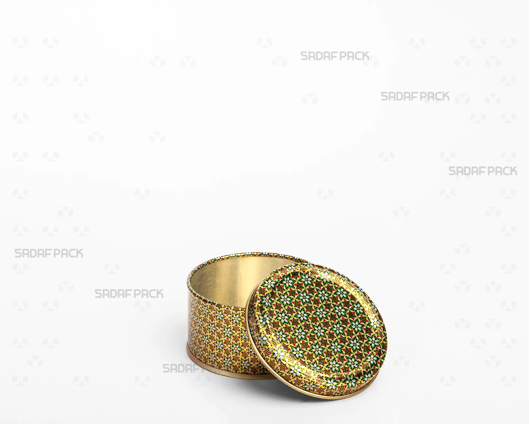 A three-quarter angle view of the Sadaf Pack 7cm diameter by 3cm height metal tin featuring the Green Khatam pattern, shown with its solid (windowless) lid open and placed beside the base.