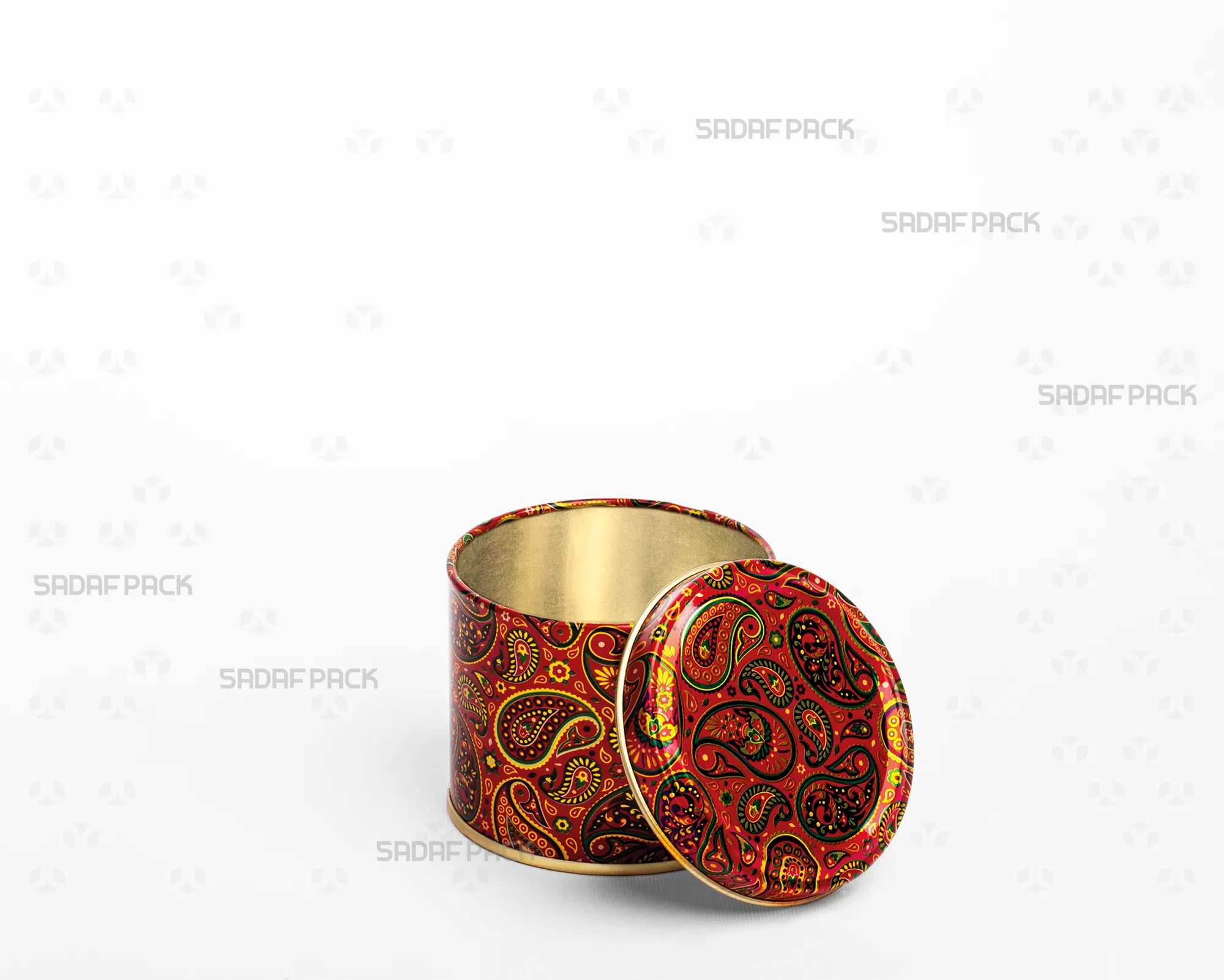 A three-quarter angle view of the Sadaf Pack 7cm diameter by 5cm height metal tin featuring the Red Termeh pattern, shown with its solid (windowless) lid open and placed beside the base.