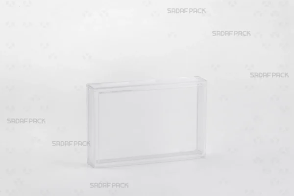 A three-quarter angle view of the 12.5 Crystal rectangular container by Sadaf Pack, showcasing its transparent design for premium product display.