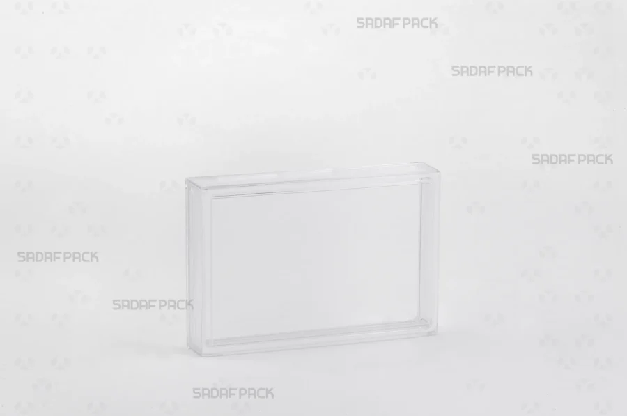 A three-quarter angle view of the 12.5 Crystal rectangular container by Sadaf Pack, showcasing its transparent design for premium product display.
