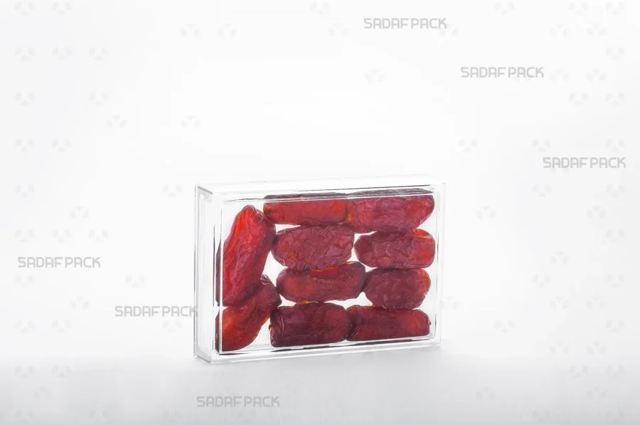 The 12.5 Crystal rectangular container filled with Arabic dates, demonstrating its use for high-value, export-quality food products.