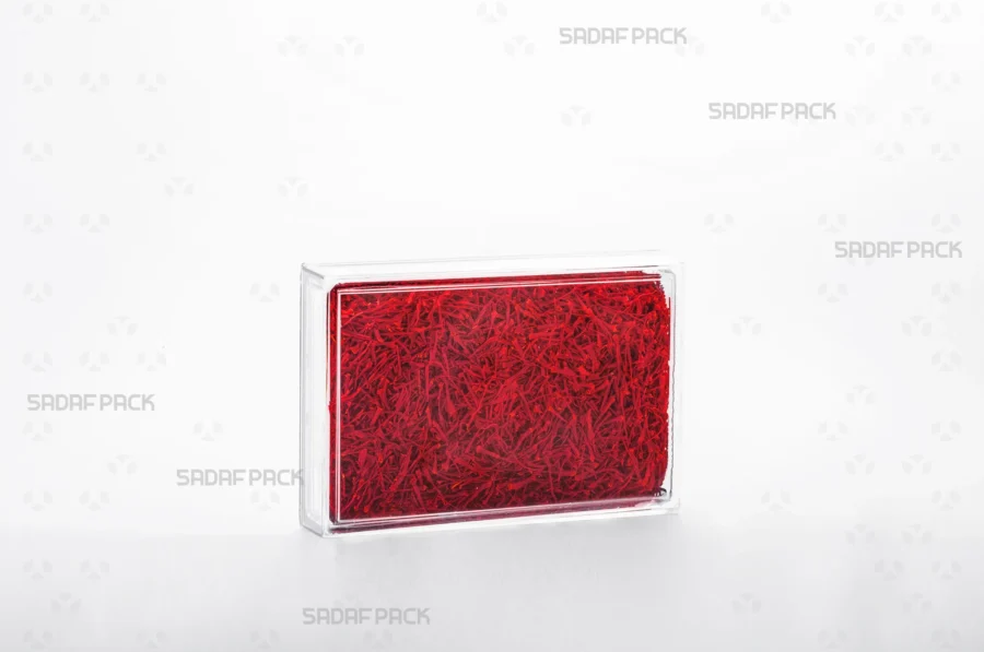 The 12.5 Crystal rectangular container filled with saffron, demonstrating its use for high-value, export-quality food products.