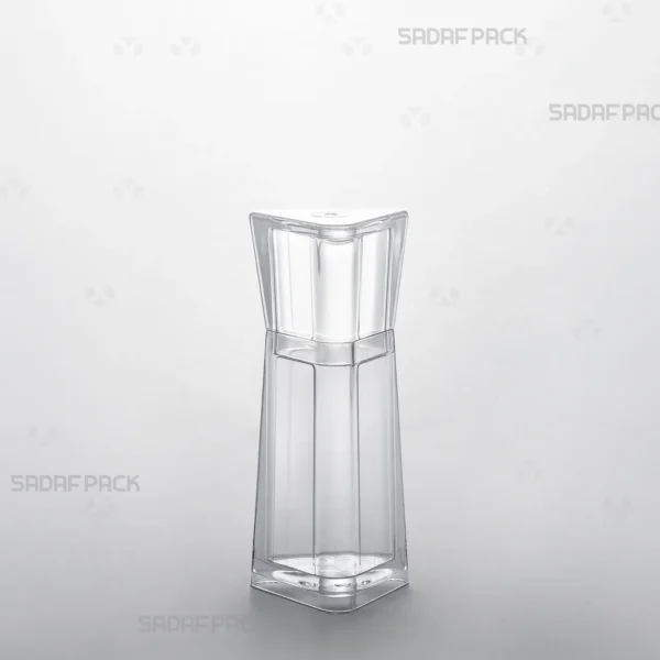 A three-quarter angle view of the elegant Almas 2 crystal saffron container by Sadaf Pack, showcasing its unique triangular design and brilliant transparency.
