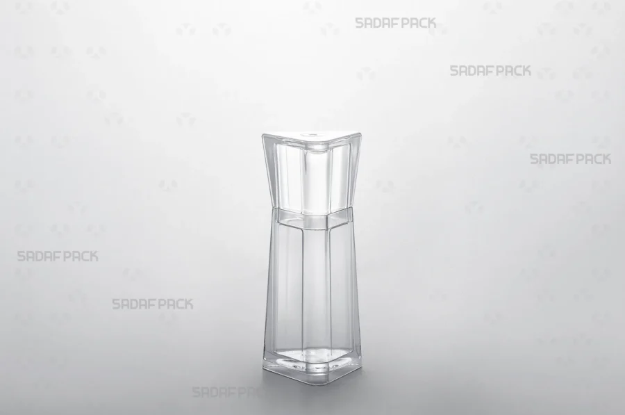A three-quarter angle view of the elegant Almas 2 crystal saffron container by Sadaf Pack, showcasing its unique triangular design and brilliant transparency.