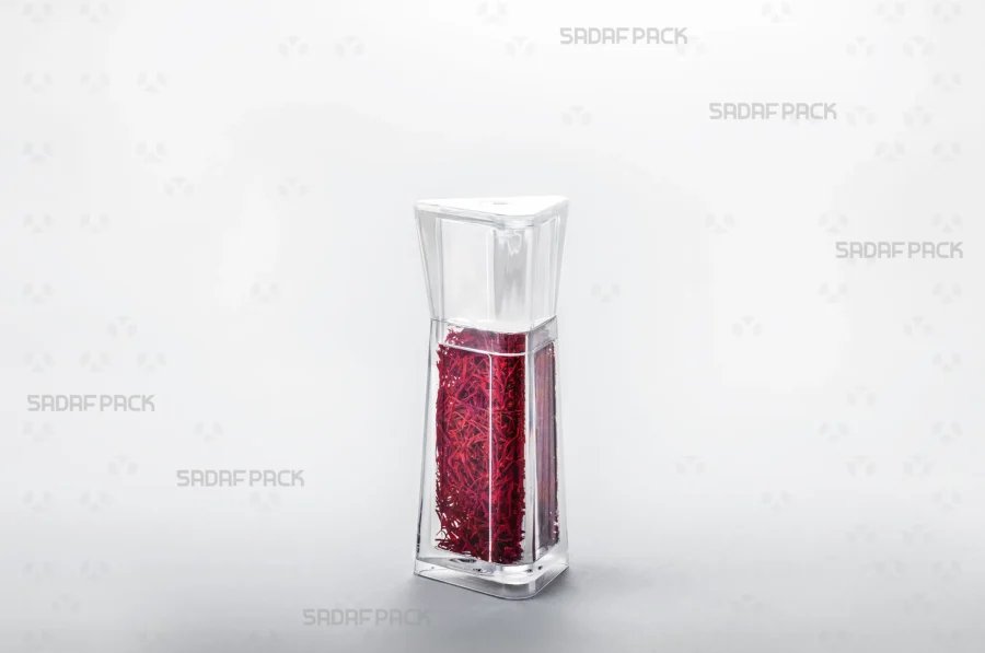 A three-quarter view of the Almas 2 container filled with saffron, demonstrating its ideal capacity for high-end saffron packaging suitable for export.