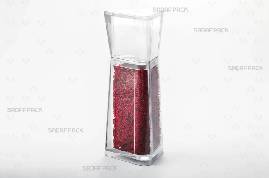 A three-quarter angle view of the Almas 4 container filled with premium saffron, demonstrating its ideal use for export