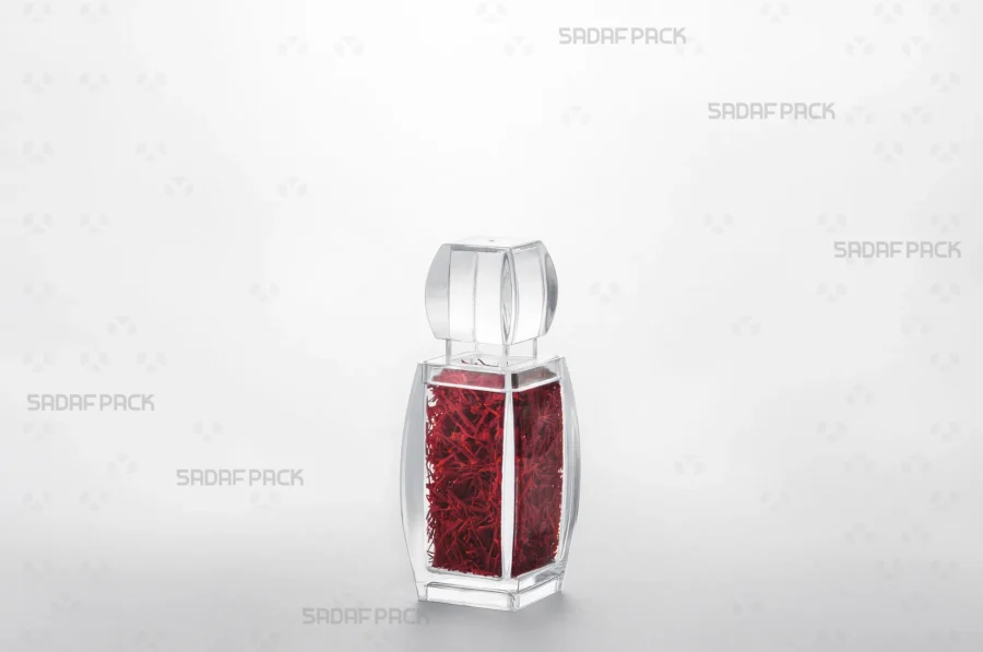 The Azin 2 crystal container filled with vibrant red saffron, demonstrating its use as an elegant and protective packaging solution for export. 