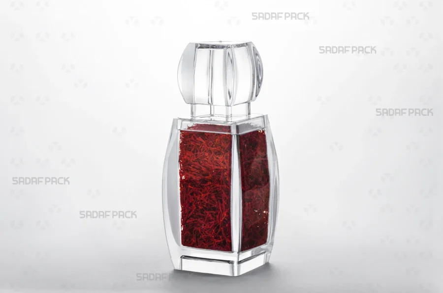 A three-quarter angle view of the Azin 4 container filled with high-quality saffron, demonstrating its suitability for the export of luxury food products.