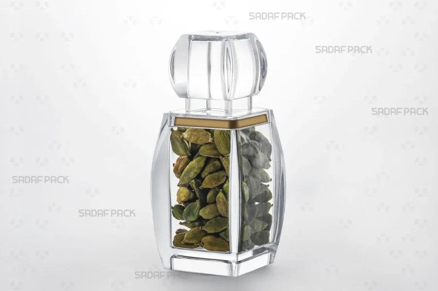 A three-quarter angle view of the Azin 5 container filled with cardamom, demonstrating its use for high-value, export-quality spices.