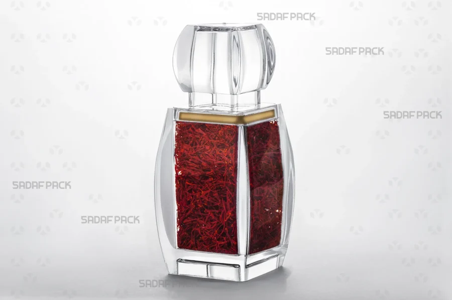 A three-quarter angle view of the Azin 5 container filled with saffron, demonstrating its use for high-value, export-quality spices.